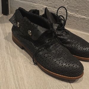 Black Boots with Textured Leather and Metallic Detail